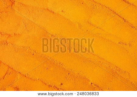 Turmeric Powder Texture Background. Herbal, Healthy Concept