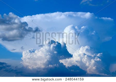 Beautiful White Clouds On Blue Sky Background. White Clouds On Boundless Sky. Blue Sky With White Cl