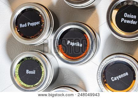 Jars Labeled And Filled With Various Different Spices