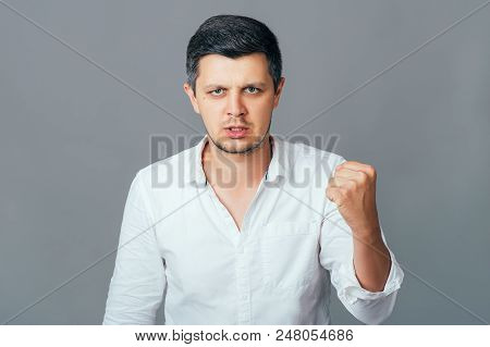 Furious Outraged Caucasian Man Threaten In Anger, Frowns His Face, Keeps Fists, Going To Defend Hims