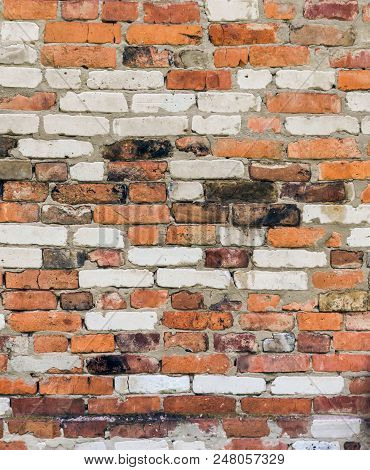 Old Brick Wall Built Of Different Bricks