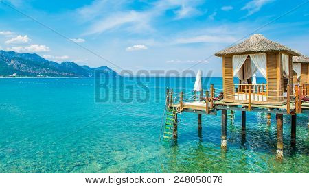 Wooden Beach Pavilions On The Shore Of A Sandy Beach - The Mediterranean Coast, Beldibi, Antalya, Tu