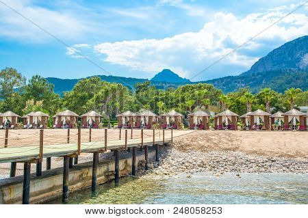 Wooden Beach Pavilions On The Shore Of A Sandy Beach - The Mediterranean Coast, Beldibi, Antalya, Tu