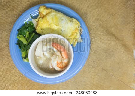 Fried Noodle In Egg With Squid, Shrimp And Kale In Gravy, Thai Food Called 