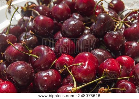 Fresh Ripe Cherry On A Plate, Top View.