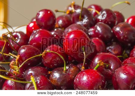 Fresh Ripe Cherry On A Plate, Top View.