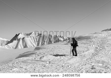 Skier On Top Of Ski Slope Staring Into Distance At Nice Winter Morning. Caucasus Mountains, Georgia,