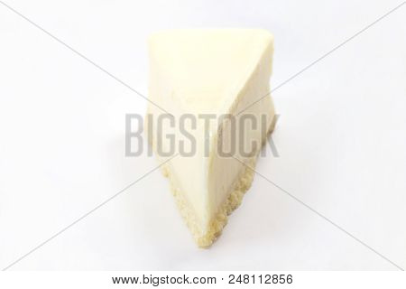 One Piece Of The Yummy Cheesecake Isolated On A White Background.frontal View.