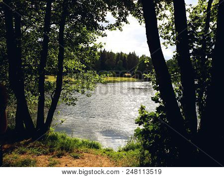 Novogrudok, Belarus - June 12, 2018: Lake Behind The Trees In A Summer Sunny Day