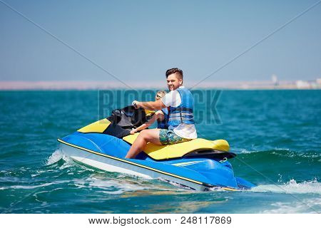 Happy, Excited Family, Father And Son Having Fun On Jet Ski At Summer Vacation