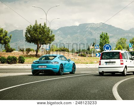 Majorca, Spain - May 10, 2018: Spanish Highway In Majorca With Luxury Cyan Colored Porsche  Sport Ca