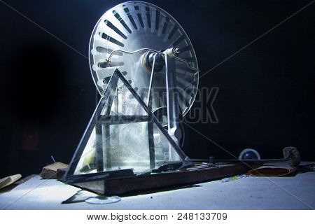 Old Electrostatic Machine, Wimshurst Generator And Glass Pyramid On Black Background. Physics Educat