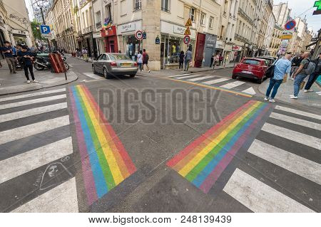 Paris, France - 24 June 2018: Gay pride flag crosswalks in Paris gay village (Le Marais)