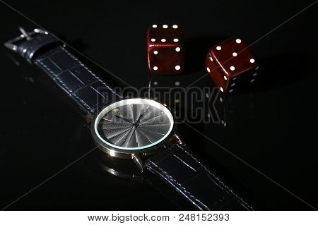 Men's Accessories For Business And Rekreation. Watch And Dice On Black Mirror Background.. Top View 