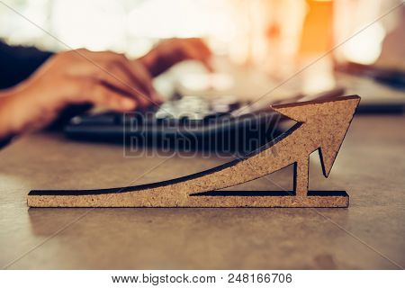 Business Metric Focus Icon And Team Businessman's Job Working With Calculator At Background