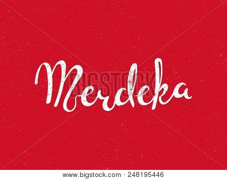 Hand Written Calligraphic Lettering Quote Merdeka Meaning Independence In Malay, Indonesian. Isolate