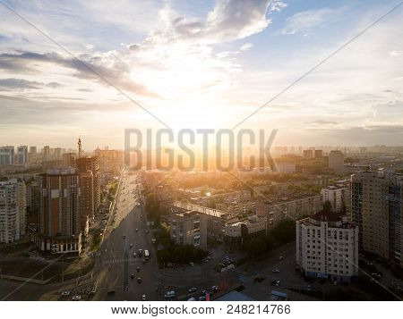 Aerial View Of Old And New Buildings In The City With Skyscrapers With Blue Sky And Clouds The Sun B