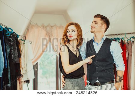 Rich Man In The Beauty Fashion Dress Shop With His Woman