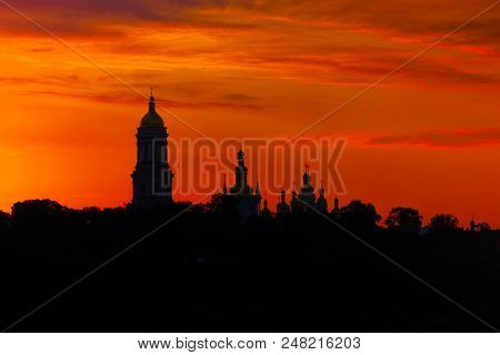 Siluette To Lavra Monastery, Kiev Landmark. Red Sunset