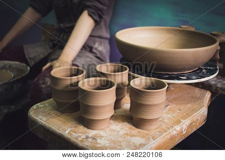 Ceramic Clay Products Stand On The Shelf Close-up. Sculptor Sculpts Pots Products From White Clay. W
