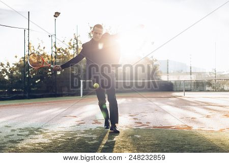 Businessman Practicing Sport In The Mornings Sunlight To Maintain Daily Tonus, Health, To Take A Bre
