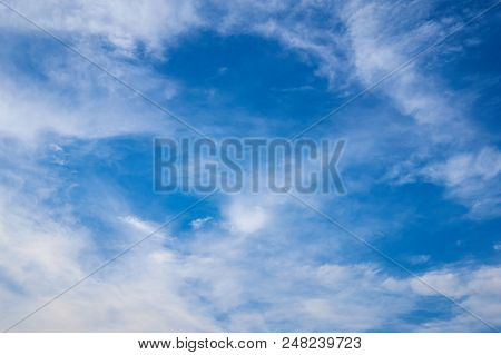 Beautiful Blue Sky With Fleecy Clouds. Abstract Background.
