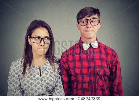 Young Man And Woman On Date Feeling Awkward Being In Embarrassed Situation