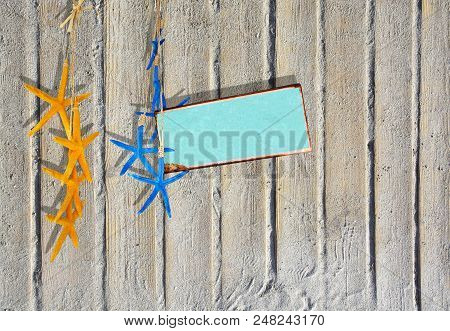 Sandy Boardwalk Planks Background With Yellow And Blue Starfish And Turquoise Metal Plate For Copy S