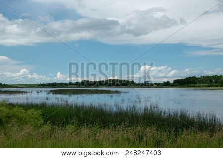 Marsh Land And Big Clouds In Saskatchewan, Canada.