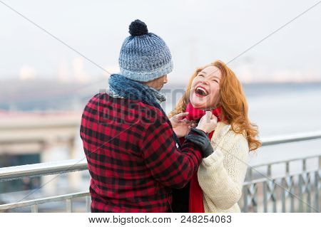 Joyful Women Loves Date. Guy Make Funny Women In Red Scarf. Rouge Women Laughing In City