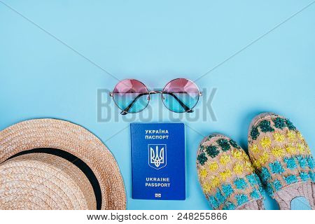 Travel Flatlay With Biometric Passport, Gradient Round Sunglasses, Straw Boater Hat And Espadrille S