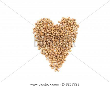 A Heap In The Form Of Heart Made Of Brown Peppercorns Is Situated On The White Background.