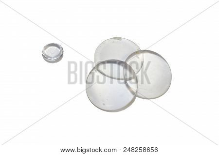 Set Of Flat-convex Glass Optical Magnifying Lenses And A Small Double-convex Lens Isolated With Clip