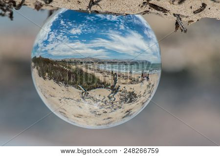 Hanging Fish Eye Globe Showing Distorted View Of Beautiful Beach Day On A Typical Sunny Summer Day I