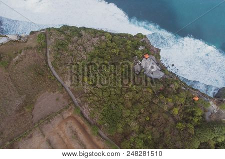 Aerial drone view of temple and beautiful Uluwatu clffs in Bali, Indonesia