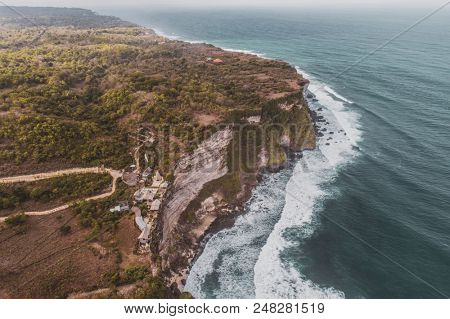 Aerial drone view of temple and beautiful Uluwatu clffs in Bali, Indonesia