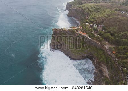 Aerial drone view of temple and beautiful Uluwatu clffs in Bali, Indonesia