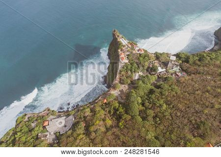 Aerial drone view of temple and beautiful Uluwatu clffs in Bali, Indonesia