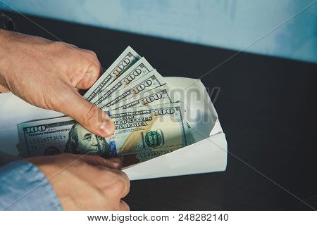 Man In Men's Suits. Bribe And Corruption With Dollar Banknotes.