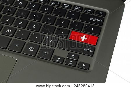 Flag Of Switzerland On Laptop Keyboard, Close-up.