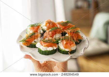 Cucumber And Salmon, Small Snacks On A Plate. Copy Space.