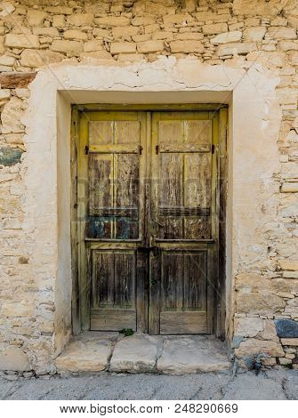 Omodos, Cyprus. May 2018. A Typical View Of An Old Building With Old Doors In The Traditional Villag