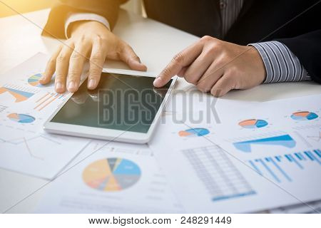 Teamwork Process, Business Adviser Analyzing Financial Figures Denoting The Progress In The Work Of 