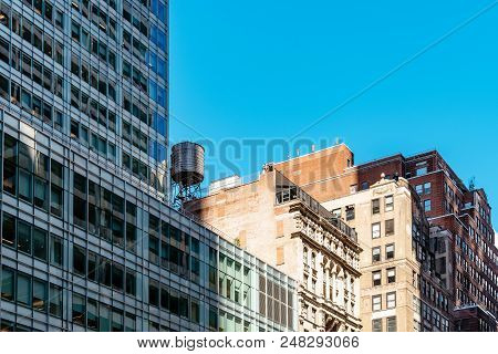 New York City, Usa - June 20, 2018: Low Angle View Of Modern And Old Buildings Against Sky In Midtow