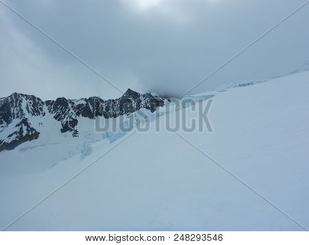 Crevasses And Seracs On A Glacier