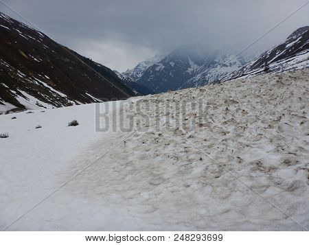 Fallen Spring Avalanche In An Alpine Valley