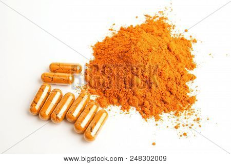 Turmeric Capsules And Turmeric Powder On White Background, Herbal