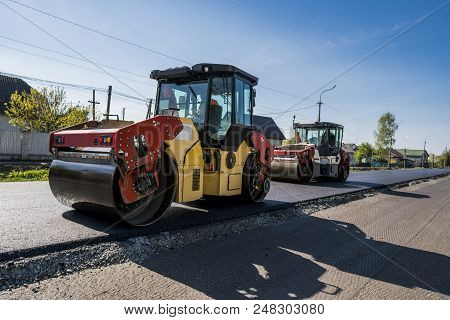 Heavy Vibration Roller At Asphalt Pavement Working On The New Road Construction Site. Repairing