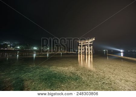 Ultra Wide Angle Long Exposure Of Miyajima With Floating Torii Gate, Night Time, High Tide, Japan.