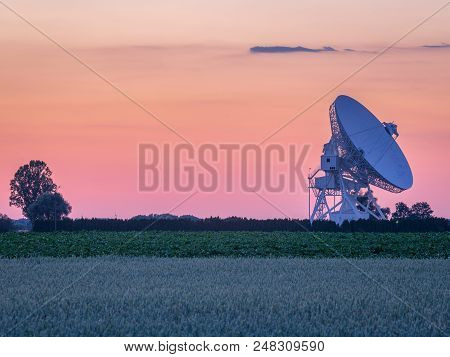 Pastel Colors On The Sky During Summer Sunset Over Radiotelescope Antenna